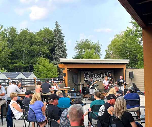 Live band playing for a crowd on the patio at The Flagstone in Appleton WI.