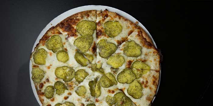 Dill pickle pizza served hot and delicious at The Flagstone in Appleton WI.